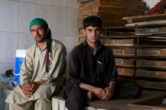 They take care of dough - storing it to rise and then hand it over to others. The trays are full of rising dough.